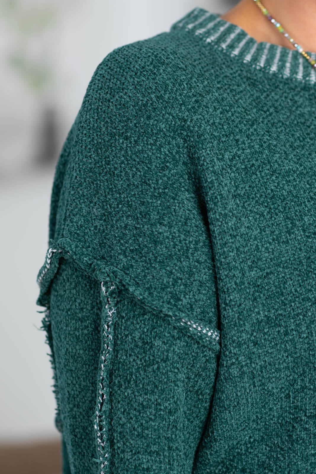 Sweater with Exposed Seam Detail